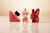 Luxury perfume bottles on marble with natural sunlight — designer fragrances available at Perfumez Direct